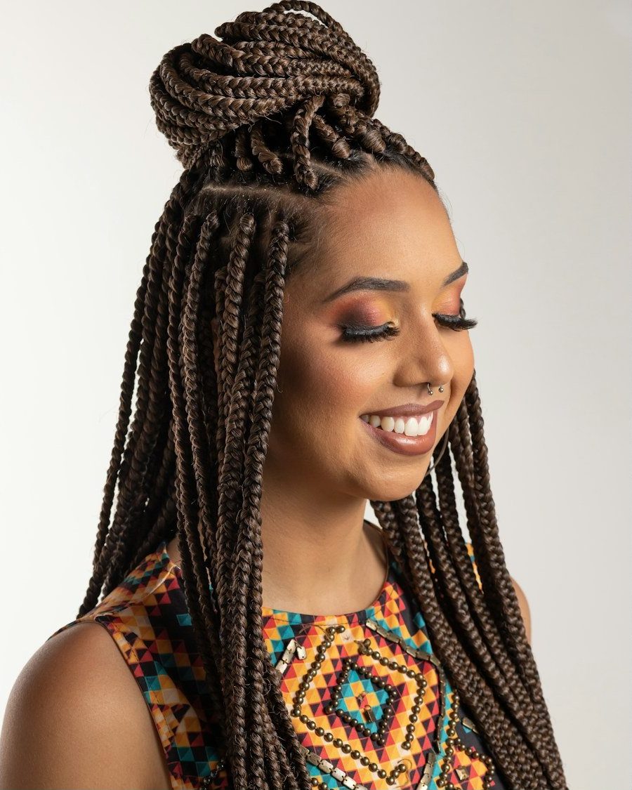 Knotless braids styled into a high updo
